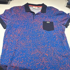 Men’s Lacoste polo with blue and orange design